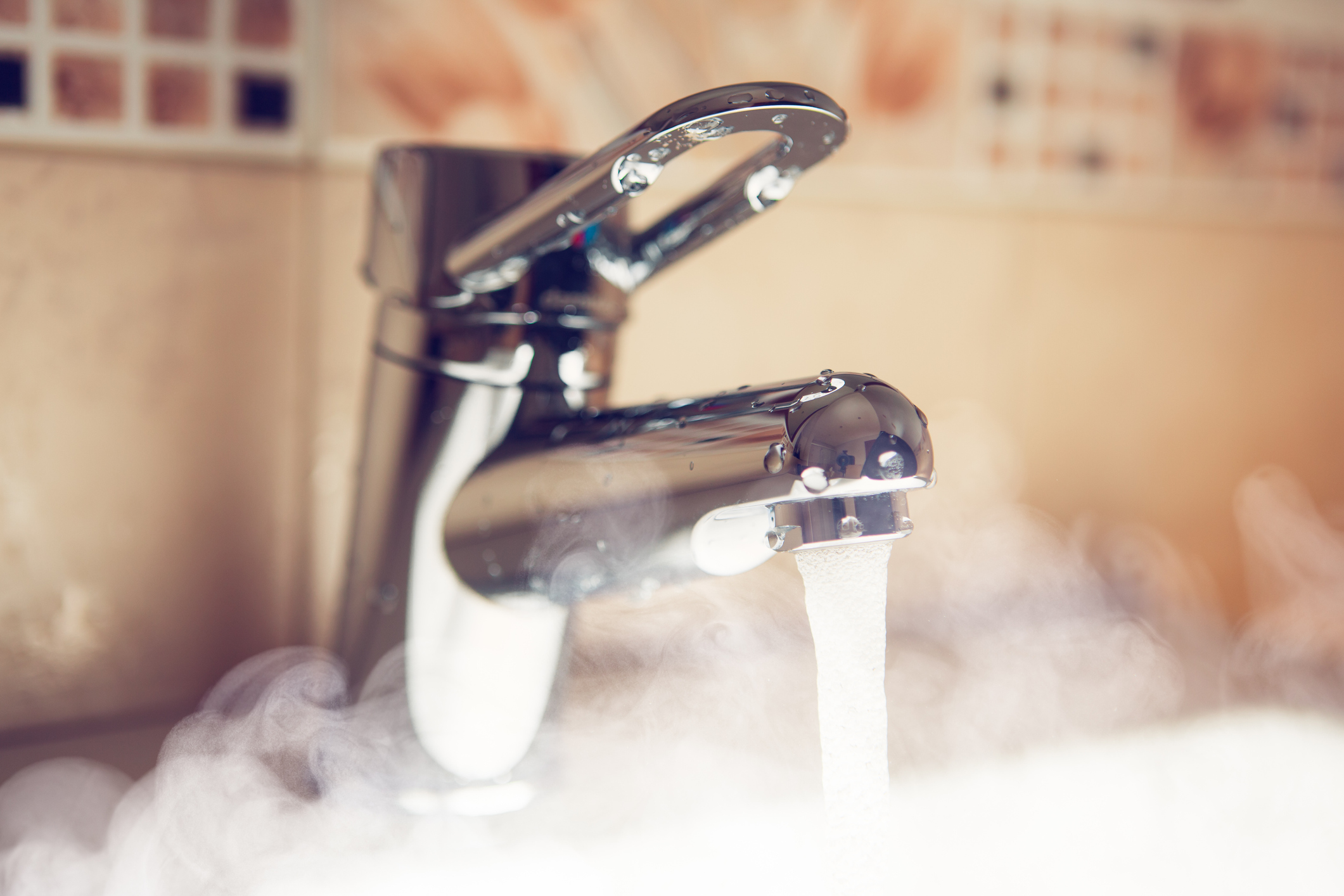 water tap with hot water steam, closeup view