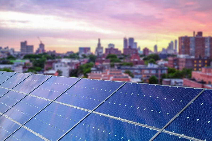 Rooftop solar panel system in New York, USA with the skyline in the background