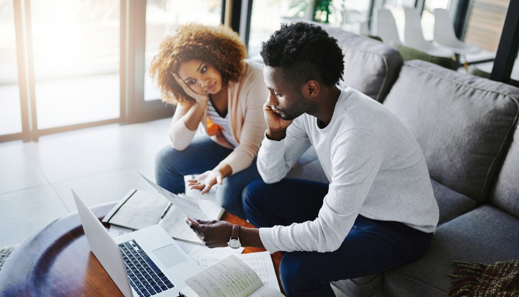Couple looking at their finances and budgeting.